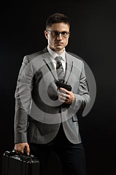 A man in a suit jacket with a gun posing as a special agent