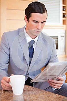 Man in suit making breakfast
