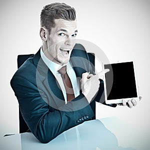 Man in suit with tablet