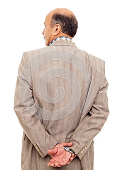 Man in the suit turned his back, taking thoughtfully his wrist