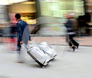 Man with suitcase in a hurry