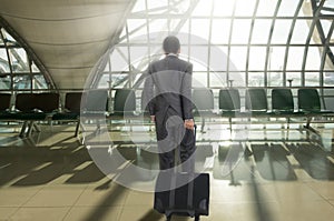 Man with suitcase in terminal airport