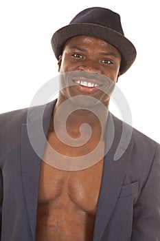 Man in suitcoat no shirt smile