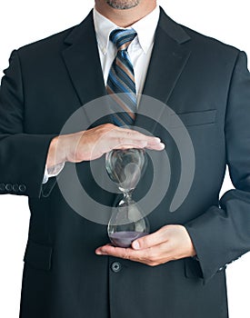 Man in suite holding hourglass