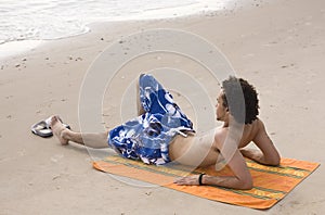 Man Sunbathing at the Beach