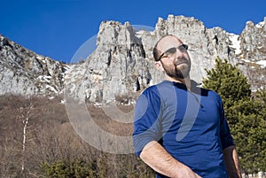 Man with sunglasses in the mountains