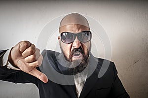 Man with sunglasses and negative expressio