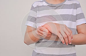 Man support a hand part that experiencing pain