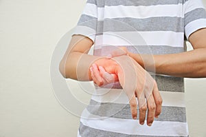 Man support a hand part that experiencing pain