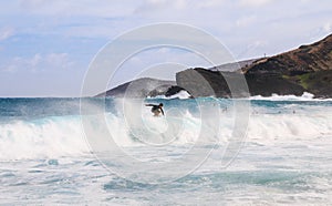 man surfing on the big wave