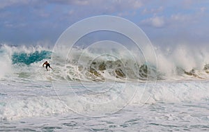 man surfing on the big wave