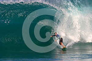 A Man Surfing a Blue Wave in Hawaii