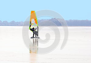 Man ice surfing skating lakes Loosdrechtse Plassen, Netherlands