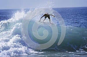 Man Surfing On Ocean Wave