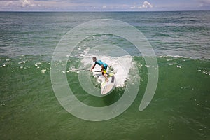 Man surfing on a paddle board