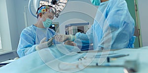 Man surgeon at work in operating room