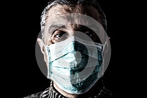 Man with surgical mask. Pandemic or epidemic and scary, fear or danger concept. Protection for biohazard like COVID-19 aka