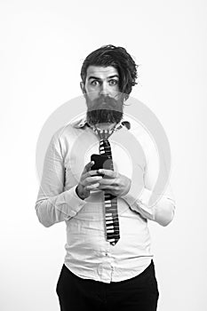 Man with surprised face hold mobile phone