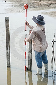 Man survey boundary of area