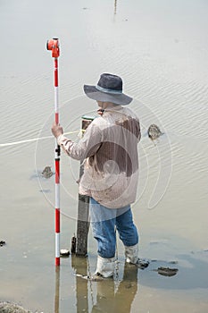 Man survey boundary of area