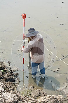 Man survey boundary of area