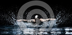 Man is swimming breaststroke. Water sports concept