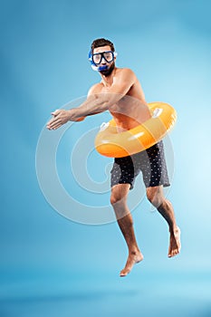 Man with swimming circle diving