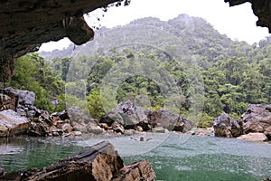 Man swimming in Nuoc Mooc lake, romantic and peaceful scenery