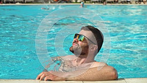 Man swimming in the outdoor pool