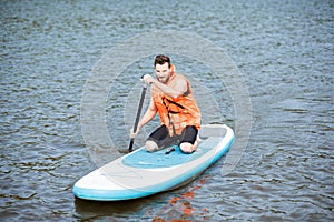 Man swimming on the paddleboard