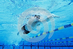 Man Swimming in Pool