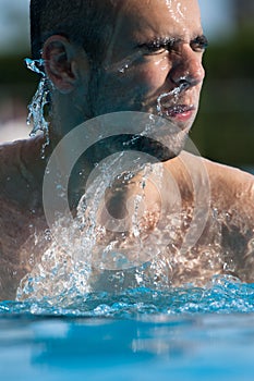 Man swimming in pool