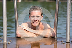Man at swimming pool enjoying the water