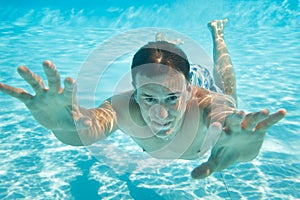 Man swimming under water