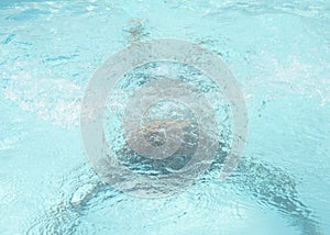 Man swimming under water in the pool. man under water in the pool