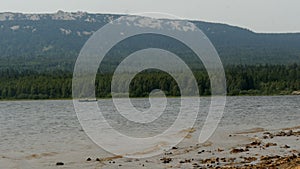 Man swims in a boat