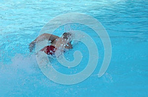 Man swims in the pool