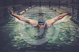 Man swims using breaststroke