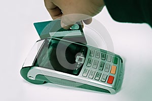 Man swiping card on a credit card machine