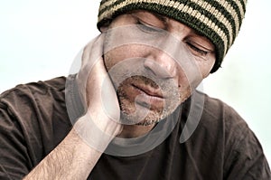 Man with swollen face suffering from toothache