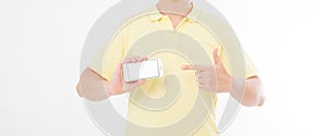 Man in t-shirt shirt holding and pointing on blank screen mobile phone isolated on white background. Arm hold smartphone, copy spa