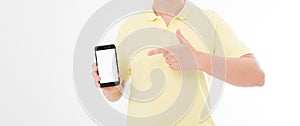 Man in t-shirt shirt holding and pointing on blank screen mobile phone isolated on white background. Arm hold smartphone, copy spa