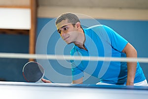 Man and table tennis match