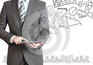 Man with tablet in hands and business sketches