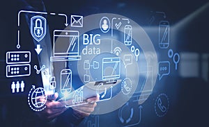 Man with tablet in office and big data interface