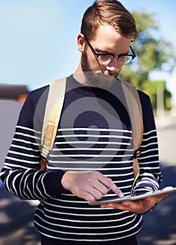 Man, tablet and scroll online while outdoor, taxi service app or rideshare for travel and connection in street photo
