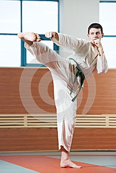 Man at taekwondo exercises