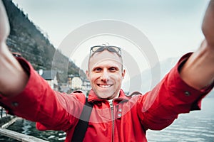 Man take his journey selfie photo with wide angle camera