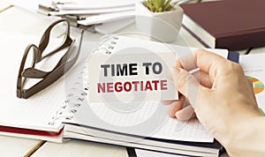 man take a paper with text Time to negotiate photo