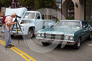 Man takes a picture of the Chevrolet El Camino 1965